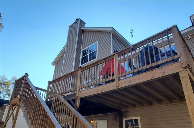 back of house featuring a deck