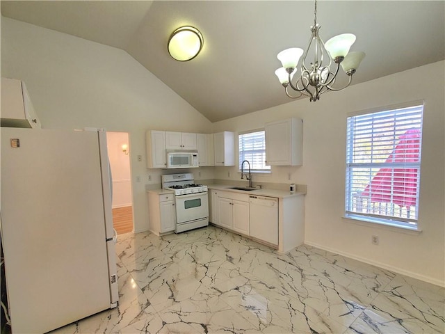 kitchen featuring white cabinetry, white appliances, a healthy amount of sunlight, and vaulted ceiling