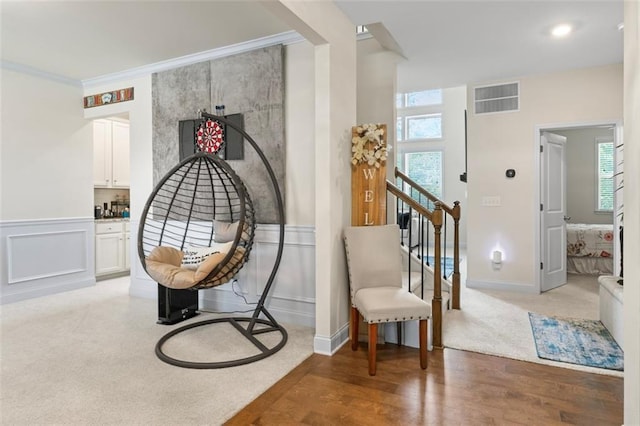 297 Aylesbury Blvd, Mcdonough, GA 30252 - sitting room featuring wood finished floors, crown molding, and wainscoting