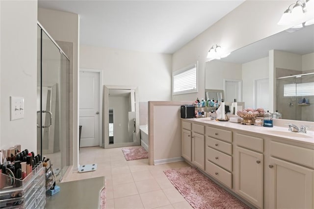 297 Aylesbury Blvd, Mcdonough, GA 30252 - full bath featuring a stall shower, double vanity, tile patterned floors, and a garden tub