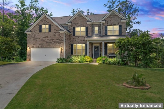 297 Aylesbury Blvd, Mcdonough, GA 30252 - view of front facade featuring driveway, brick siding, a garage, and a front yard