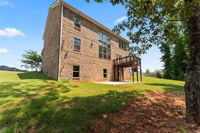 297 Aylesbury Blvd, Mcdonough, GA 30252 - back of house with a lawn, brick siding, a deck, and a patio