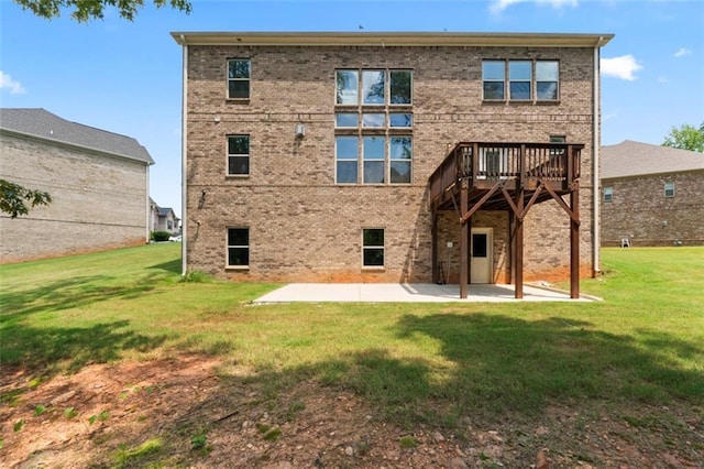 297 Aylesbury Blvd, Mcdonough, GA 30252 - rear view of house featuring a patio area, a lawn, brick siding, and a wooden deck