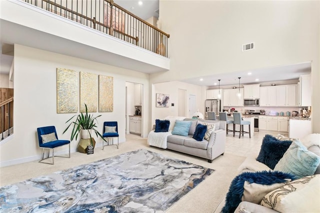 297 Aylesbury Blvd, Mcdonough, GA 30252 - living area with a towering ceiling, light carpet, recessed lighting, and stairway