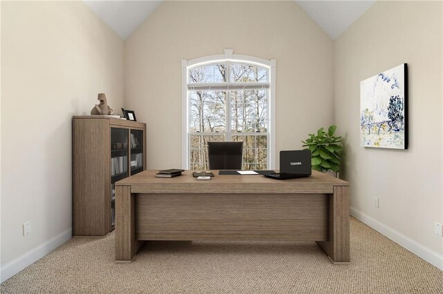 office space with light carpet, baseboards, and lofted ceiling