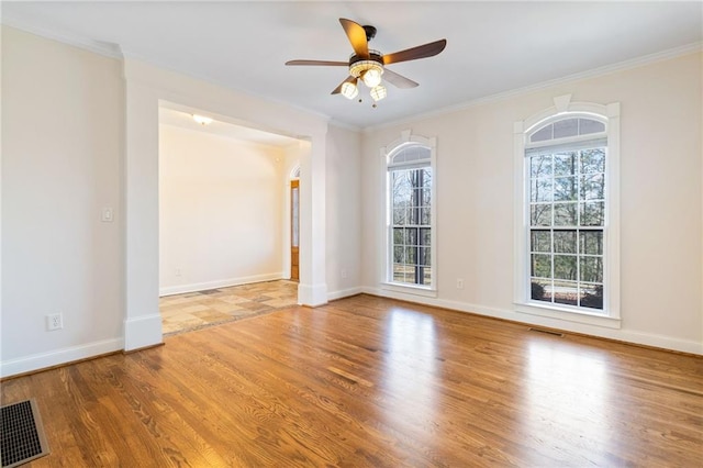 unfurnished room featuring crown molding, ceiling fan, and wood-type flooring