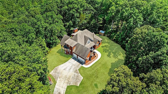 drone / aerial view featuring a view of trees