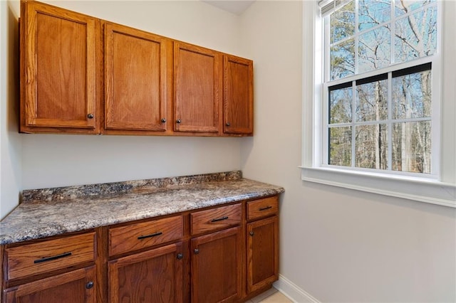 kitchen featuring stone counters