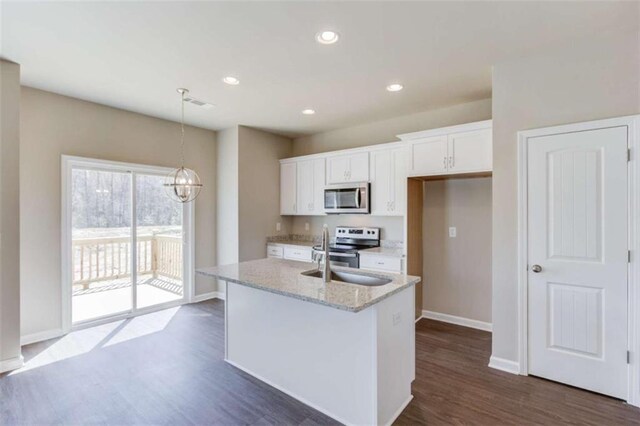 kitchen featuring light stone counters, stainless steel appliances, dark wood-type flooring, sink, and white cabinets