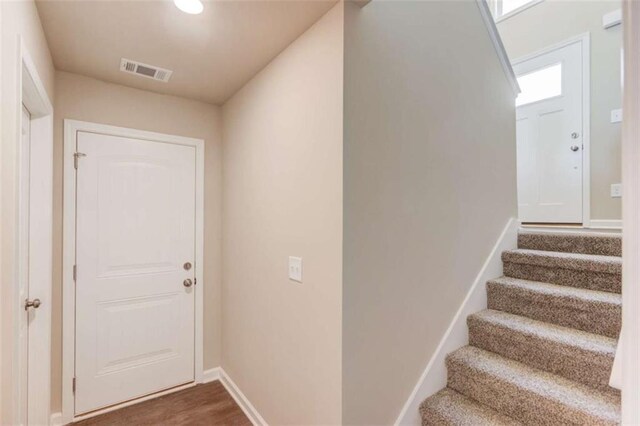 interior space with dark wood-type flooring