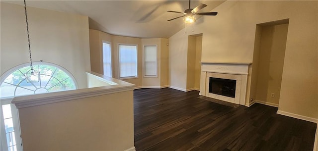 unfurnished living room featuring ceiling fan, lofted ceiling, a fireplace, and dark hardwood / wood-style flooring