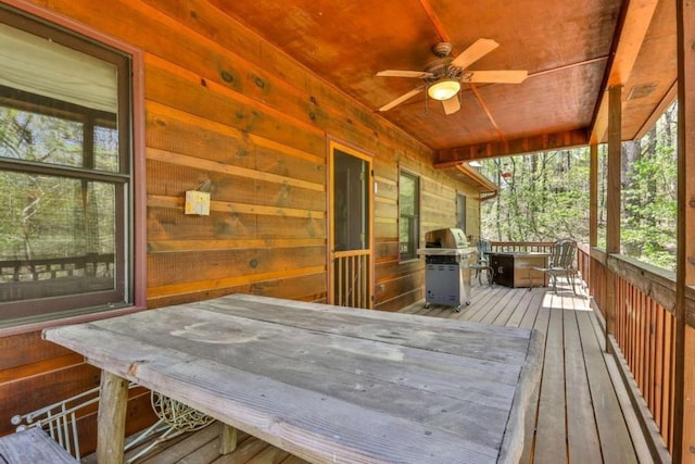 deck featuring a grill and ceiling fan