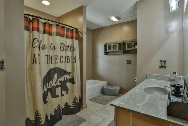 bathroom featuring a shower with shower curtain, tile patterned floors, vanity, and a textured ceiling