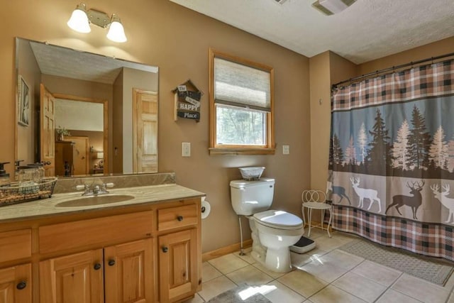 full bathroom featuring vanity, a shower with shower curtain, baseboards, tile patterned floors, and toilet