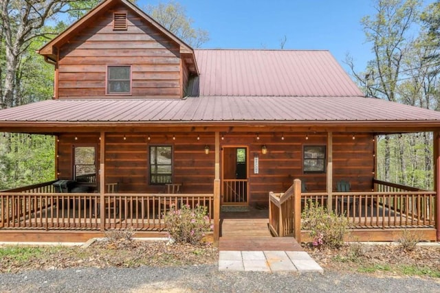 view of front of property with a porch and metal roof