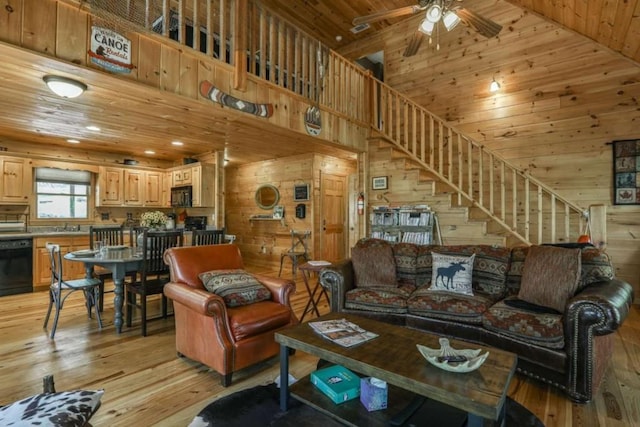 living area with wooden ceiling, light wood-type flooring, wood walls, and high vaulted ceiling