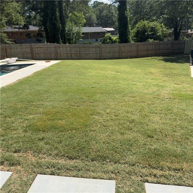 view of yard with a fenced backyard