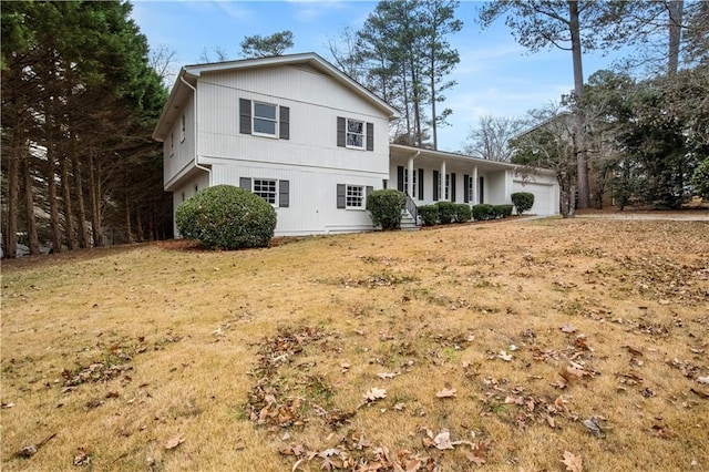 view of front of home with a porch and a garage