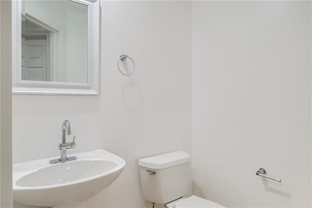 bathroom featuring sink and toilet