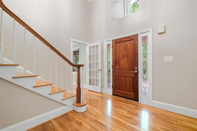 465 Willowbrook Dr SE, Smyrna, GA 30082 - foyer entrance featuring baseboards, wood finished floors, stairway, and a towering ceiling
