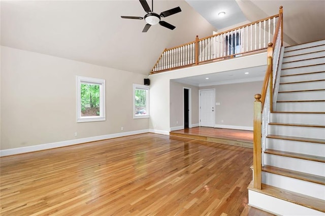 465 Willowbrook Dr SE, Smyrna, GA 30082 - unfurnished living room featuring high vaulted ceiling, ceiling fan, light wood finished floors, stairway, and baseboards