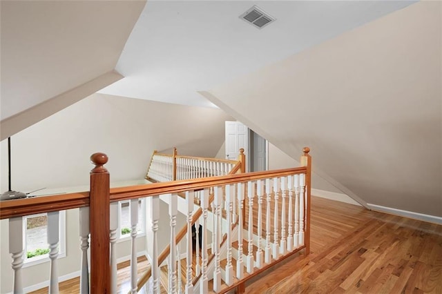 465 Willowbrook Dr SE, Smyrna, GA 30082 - corridor with wood finished floors, an upstairs landing, baseboards, and lofted ceiling