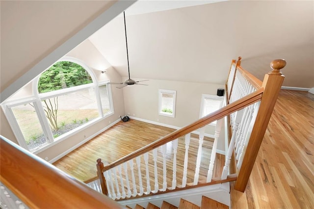 465 Willowbrook Dr SE, Smyrna, GA 30082 - stairway with baseboards, wood finished floors, vaulted ceiling, and a ceiling fan