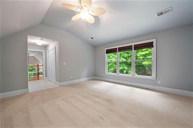 465 Willowbrook Dr SE, Smyrna, GA 30082 - spare room with light colored carpet, vaulted ceiling, ceiling fan, and baseboards
