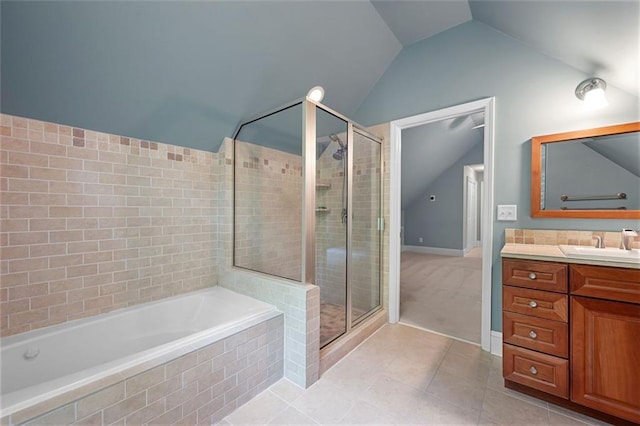 465 Willowbrook Dr SE, Smyrna, GA 30082 - bathroom with lofted ceiling, tile patterned flooring, a shower stall, vanity, and a garden tub