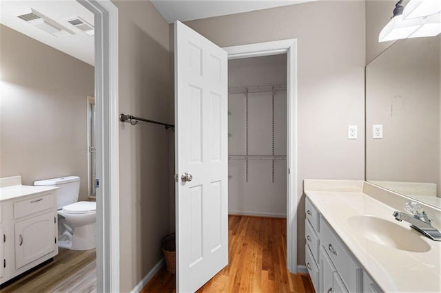 465 Willowbrook Dr SE, Smyrna, GA 30082 - full bath with vanity, wood finished floors, and toilet