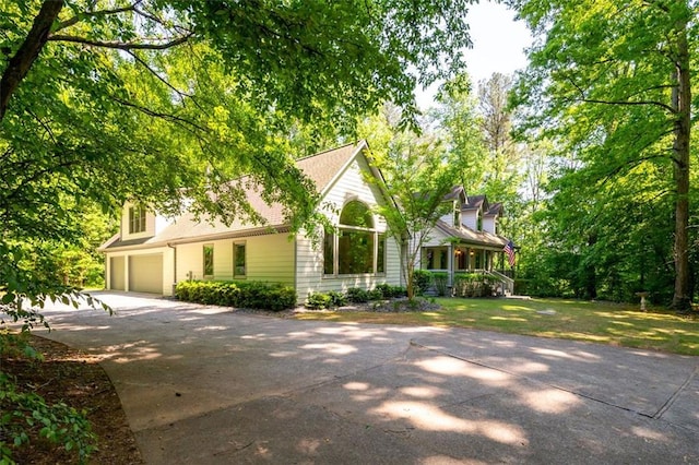 465 Willowbrook Dr SE, Smyrna, GA 30082 - view of front of house featuring concrete driveway, a garage, and a porch
