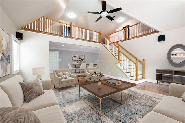465 Willowbrook Dr SE, Smyrna, GA 30082 - living room with high vaulted ceiling, ceiling fan, stairway, wood finished floors, and baseboards