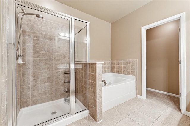 bathroom featuring tile patterned flooring and shower with separate bathtub