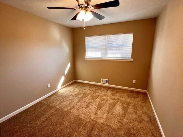 carpeted empty room with ceiling fan