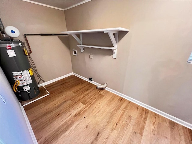 laundry room with hardwood / wood-style flooring, gas water heater, and hookup for a washing machine