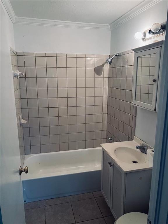 full bathroom with tiled shower / bath combo, ornamental molding, and tile patterned floors