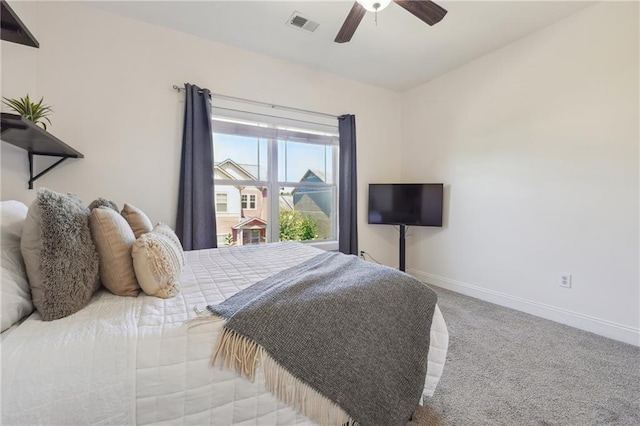 bedroom with ceiling fan and light carpet