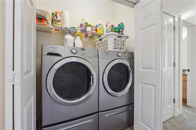 washroom featuring washer and clothes dryer