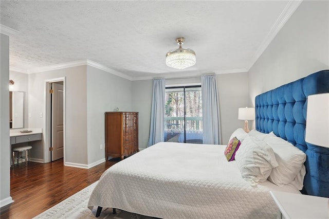 bedroom with a textured ceiling, crown molding, baseboards, and wood finished floors