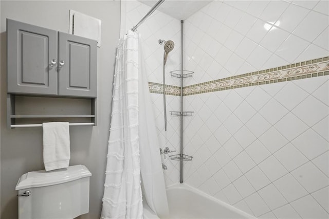 full bath with toilet and shower / bath combo