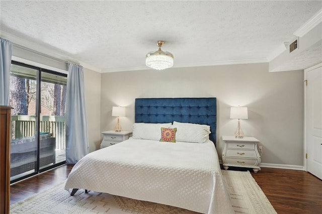 bedroom with a textured ceiling, access to outside, wood finished floors, and ornamental molding