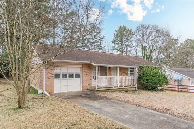 ranch-style house with a garage, a front yard, and covered porch