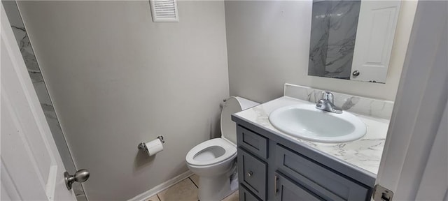 half bath with tile patterned floors, visible vents, toilet, and vanity