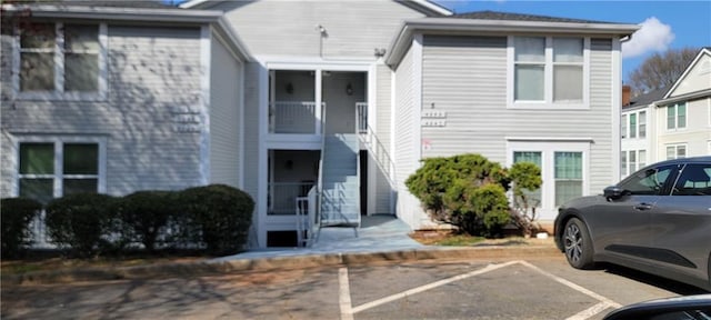 view of property with uncovered parking