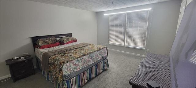 bedroom with baseboards, a textured ceiling, and carpet flooring