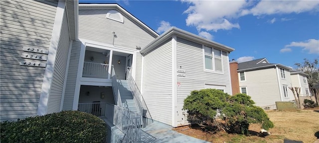 view of property exterior featuring stairway