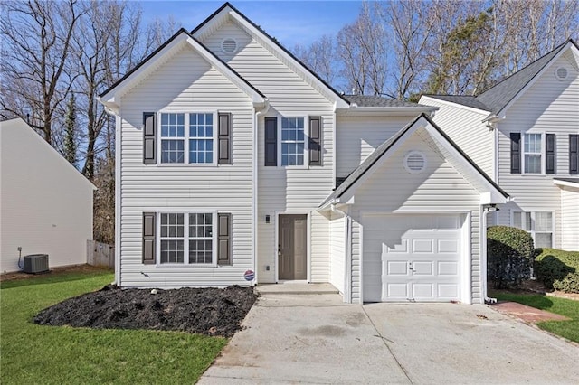 traditional-style house with driveway and central air condition unit