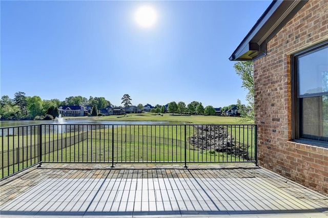 view of patio / terrace with a water view and golf course view
