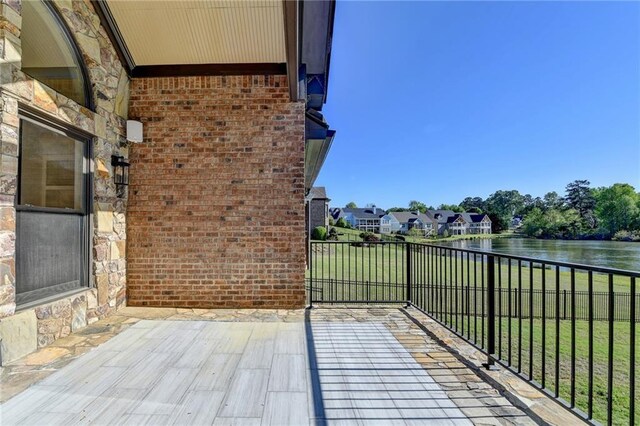 balcony featuring a water view
