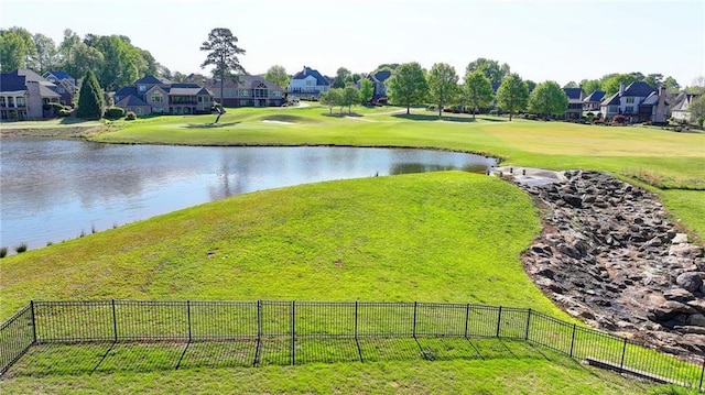 view of water feature with fence and a residential view